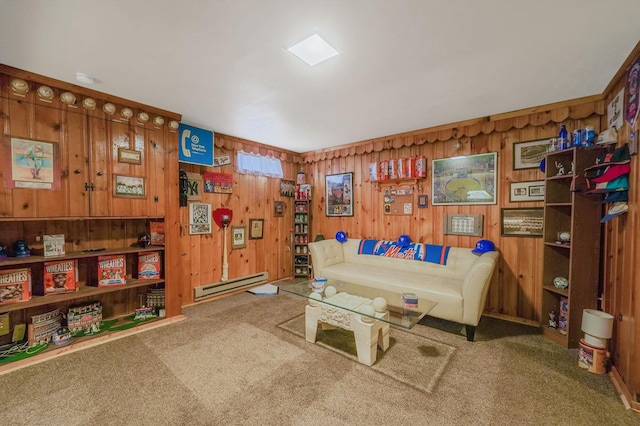 carpeted living area featuring wooden walls and a baseboard radiator