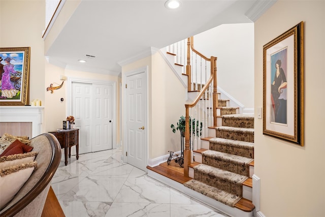 interior space with visible vents, marble finish floor, ornamental molding, recessed lighting, and a fireplace