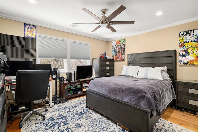 bedroom featuring visible vents, a ceiling fan, wood finished floors, recessed lighting, and crown molding