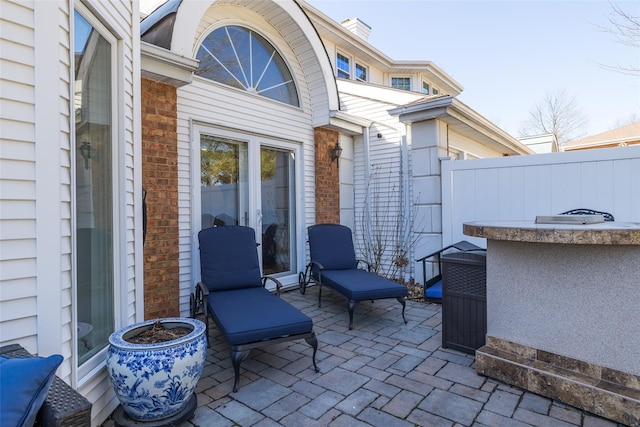 view of patio / terrace featuring fence