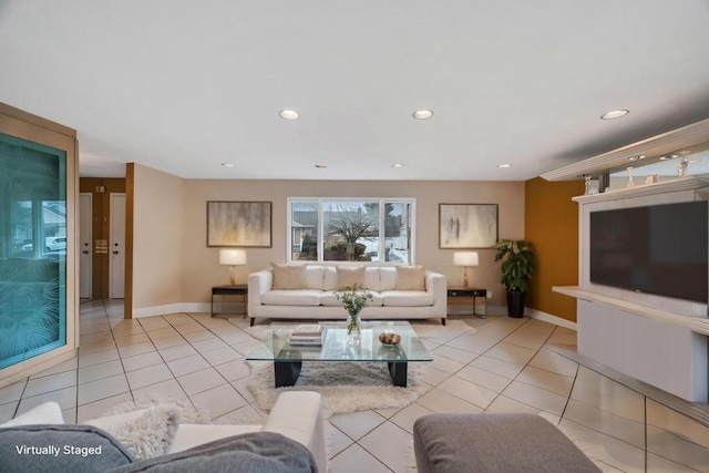 living room featuring light tile patterned floors, baseboards, and recessed lighting