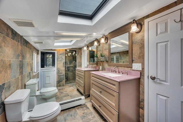 bathroom featuring visible vents, toilet, a stall shower, a baseboard heating unit, and tile walls