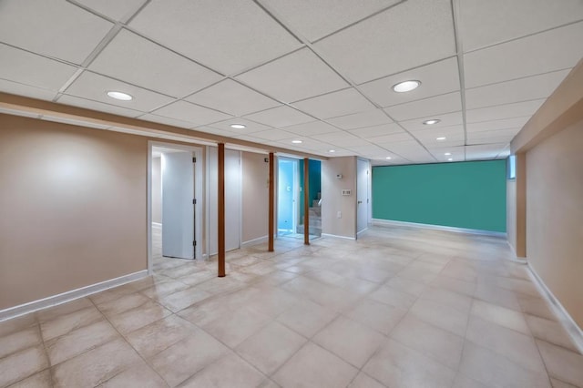 interior space featuring recessed lighting, a paneled ceiling, and baseboards