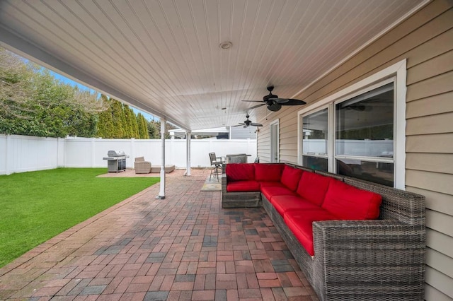 view of patio / terrace featuring outdoor dining space, an outdoor living space, a fenced backyard, ceiling fan, and a grill
