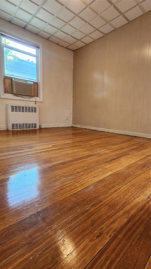 149-03 Reeves Ave, Flushing, NY 11367 - unfurnished room with radiator and wood finished floors