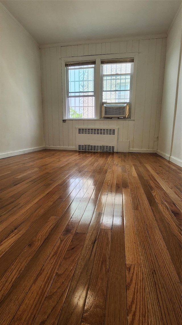 149-03 Reeves Ave, Flushing, NY 11367 - spare room with radiator heating unit, hardwood / wood-style floors, healthy amount of natural light, and cooling unit
