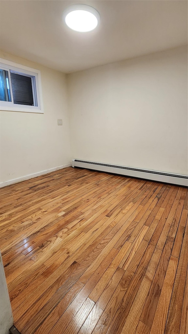 149-03 Reeves Ave, Flushing, NY 11367 - spare room with hardwood / wood-style flooring and a baseboard radiator
