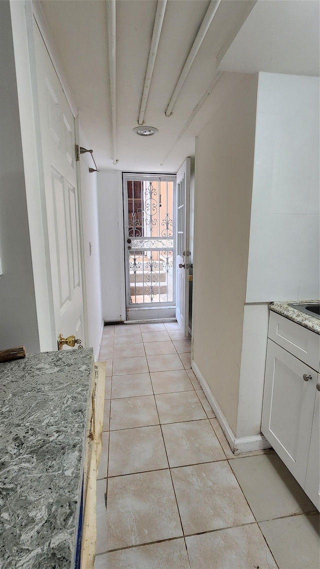 149-03 Reeves Ave, Flushing, NY 11367 - hallway with light tile patterned floors and baseboards