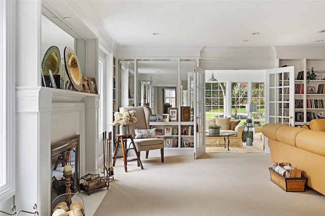 interior space featuring crown molding, carpet flooring, and a fireplace with flush hearth