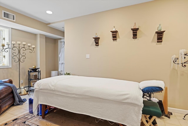 bedroom featuring light tile patterned floors, visible vents, baseboards, and recessed lighting