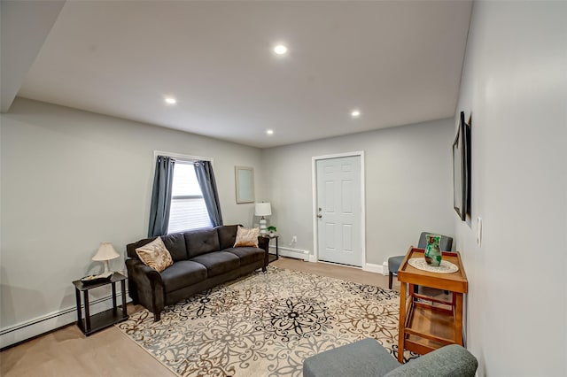 living room with light wood finished floors, recessed lighting, baseboards, and baseboard heating