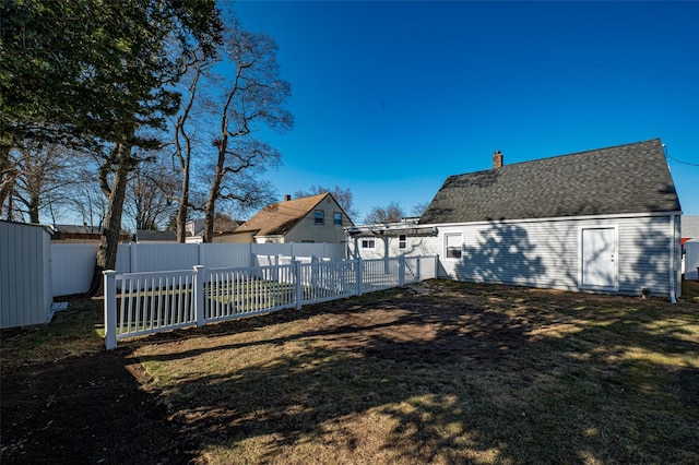 view of yard with a fenced backyard