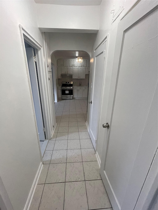 63-60 102nd St Unit B-14, Rego Park, NY 11374 - hallway with arched walkways and baseboards