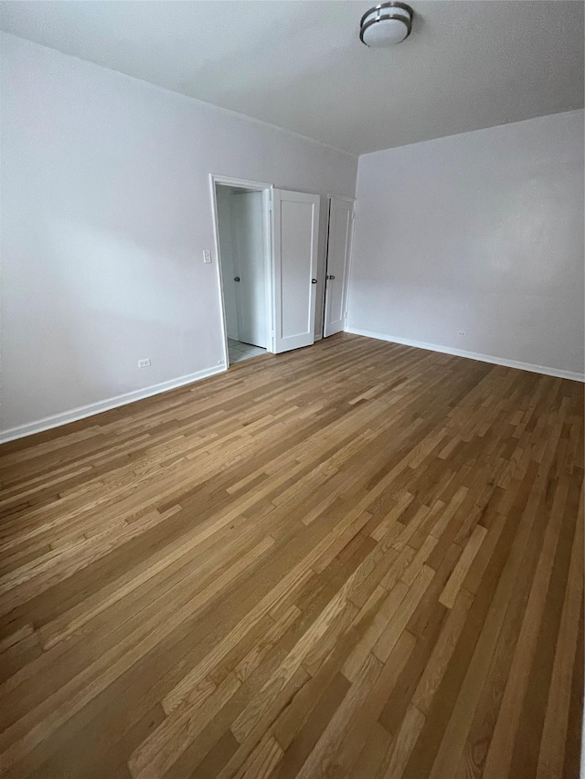 63-60 102nd St Unit B-14, Rego Park, NY 11374 - empty room with wood finished floors and baseboards