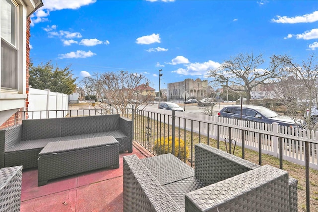 wooden deck with fence, a residential view, and an outdoor hangout area