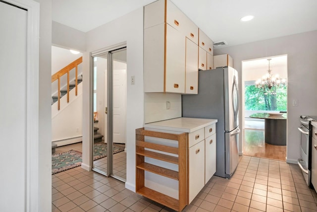 707 Eagle Bay Dr, Ossining, NY 10562 - kitchen with a baseboard radiator, light countertops, a chandelier, light tile patterned floors, and recessed lighting