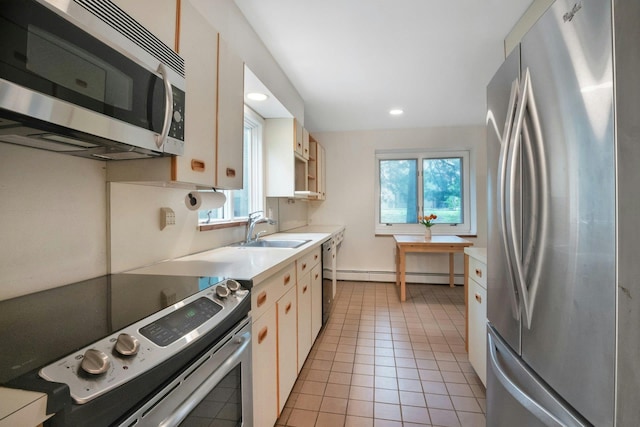 707 Eagle Bay Dr, Ossining, NY 10562 - kitchen featuring appliances with stainless steel finishes, a sink, healthy amount of natural light, a baseboard radiator, and recessed lighting