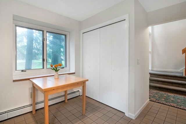 707 Eagle Bay Dr, Ossining, NY 10562 - foyer featuring a baseboard radiator, light tile patterned floors, stairway, and baseboards
