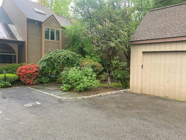 707 Eagle Bay Dr, Ossining, NY 10562 - view of property exterior featuring roof with shingles and a chimney