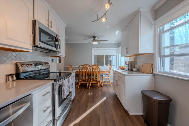 kitchen with white cabinetry, appliances with stainless steel finishes, and light countertops