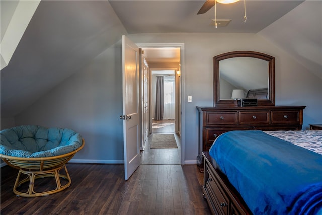 bedroom featuring ceiling fan, baseboards, dark wood finished floors, and vaulted ceiling