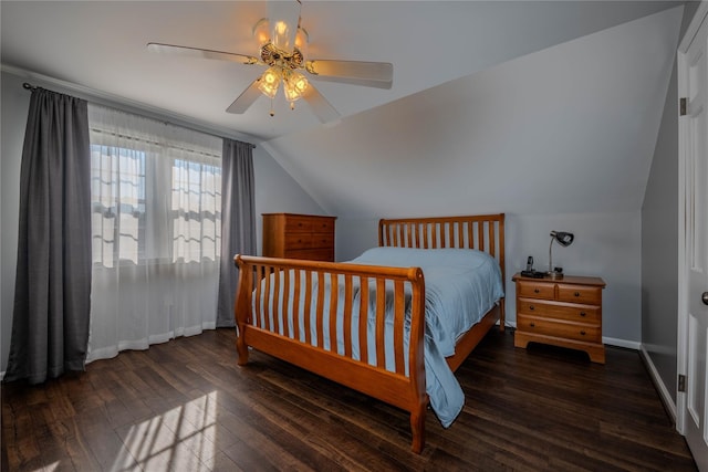 bedroom featuring hardwood / wood-style flooring, a ceiling fan, baseboards, and lofted ceiling