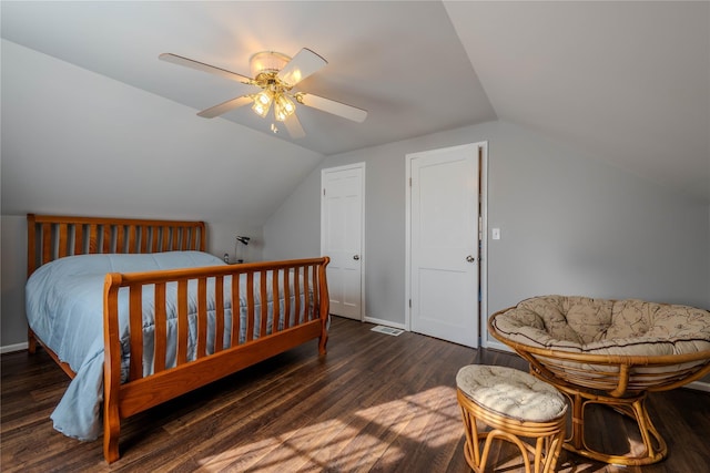 bedroom featuring ceiling fan, baseboards, lofted ceiling, and wood finished floors