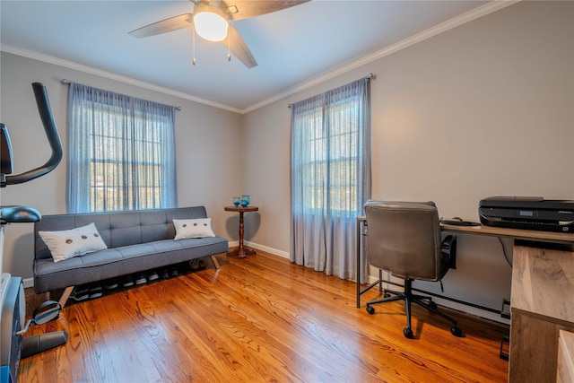 home office featuring ceiling fan, baseboards, ornamental molding, and light wood finished floors