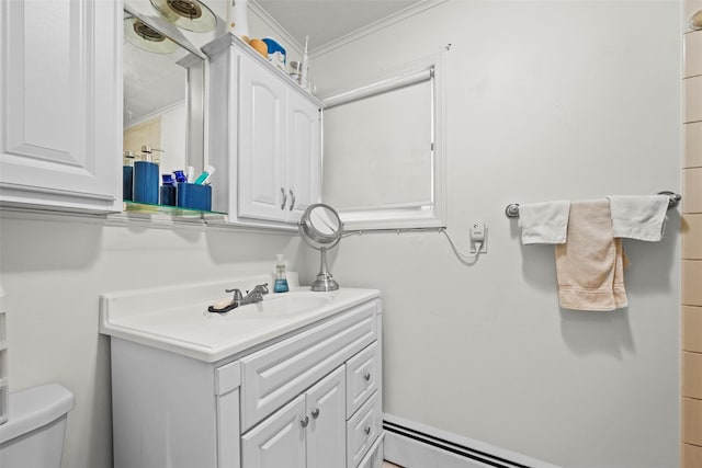 bathroom featuring baseboard heating, vanity, and toilet