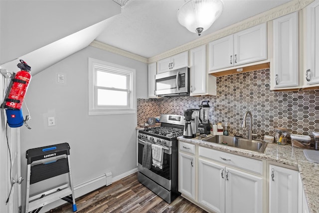 kitchen with a sink, baseboards, decorative backsplash, stainless steel appliances, and dark wood-style flooring