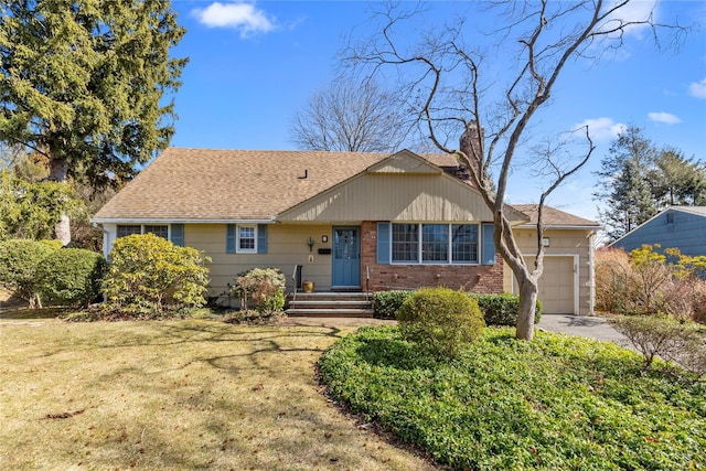 ranch-style home featuring a front yard, driveway, roof with shingles, an attached garage, and brick siding