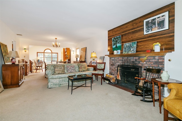 carpeted living room with an inviting chandelier and a fireplace