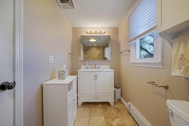 bathroom featuring visible vents, toilet, baseboard heating, vanity, and a shower