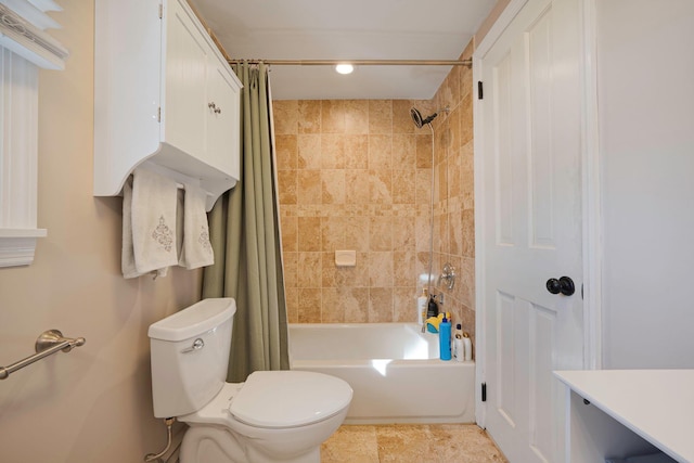 full bathroom featuring tile patterned flooring, toilet, and shower / bathtub combination with curtain