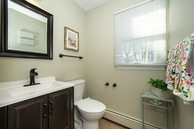 bathroom featuring tile patterned flooring, vanity, toilet, and a baseboard heating unit