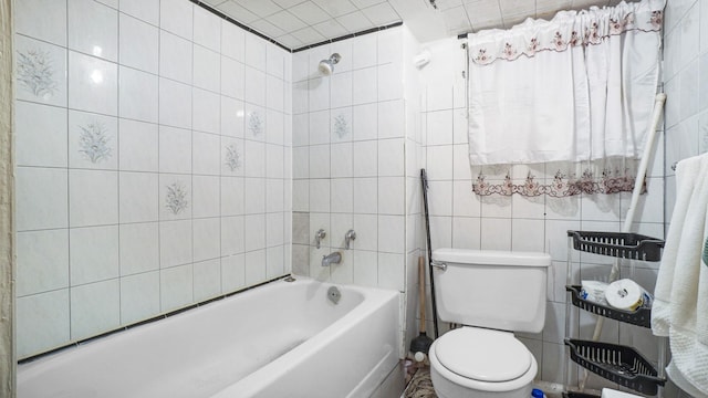 full bathroom with a shower, a bathtub, tile walls, and toilet