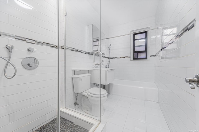 full bathroom featuring tile patterned floors and toilet