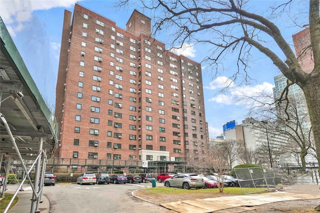 view of property featuring uncovered parking