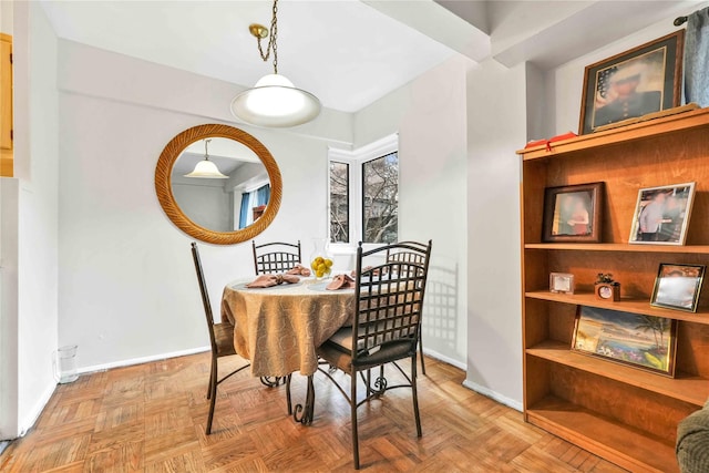 dining area featuring baseboards