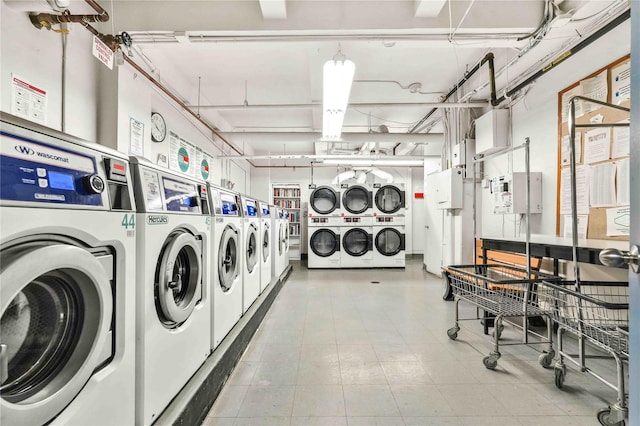 community laundry room with washing machine and clothes dryer and stacked washer / drying machine