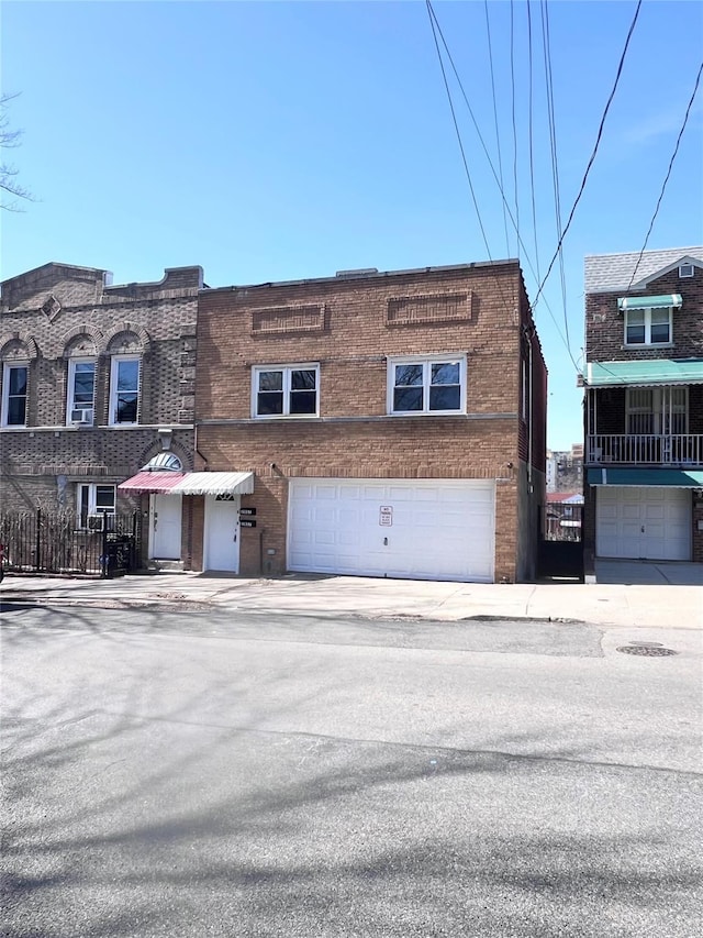 view of front of property with brick siding and an attached garage