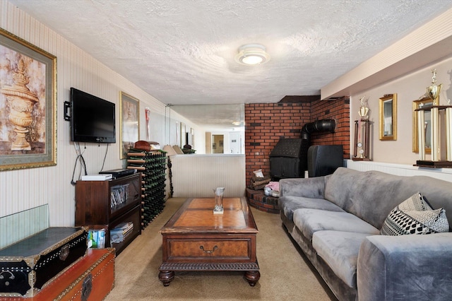 carpeted living room featuring a wood stove and a textured ceiling