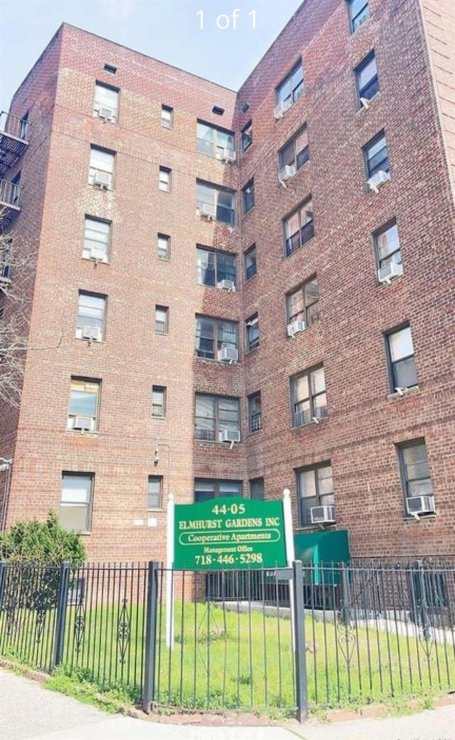 view of property featuring cooling unit and fence