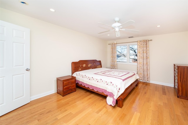 bedroom featuring visible vents, baseboards, light wood-type flooring, recessed lighting, and a ceiling fan