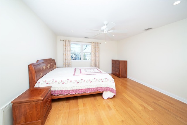 bedroom featuring visible vents, ceiling fan, baseboards, light wood-type flooring, and recessed lighting