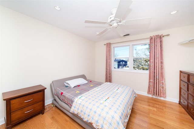 bedroom featuring recessed lighting, baseboards, light wood-style flooring, and a ceiling fan