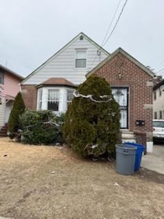 view of front of house with brick siding