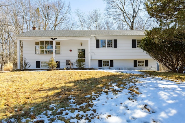 bi-level home featuring a chimney