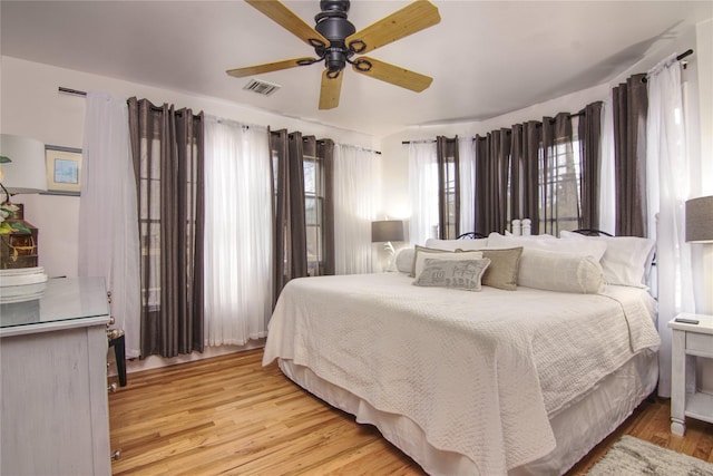 301 Lewis Walk, Cherry Grove, NY 11782 - bedroom featuring wood finished floors, ceiling fan, and visible vents