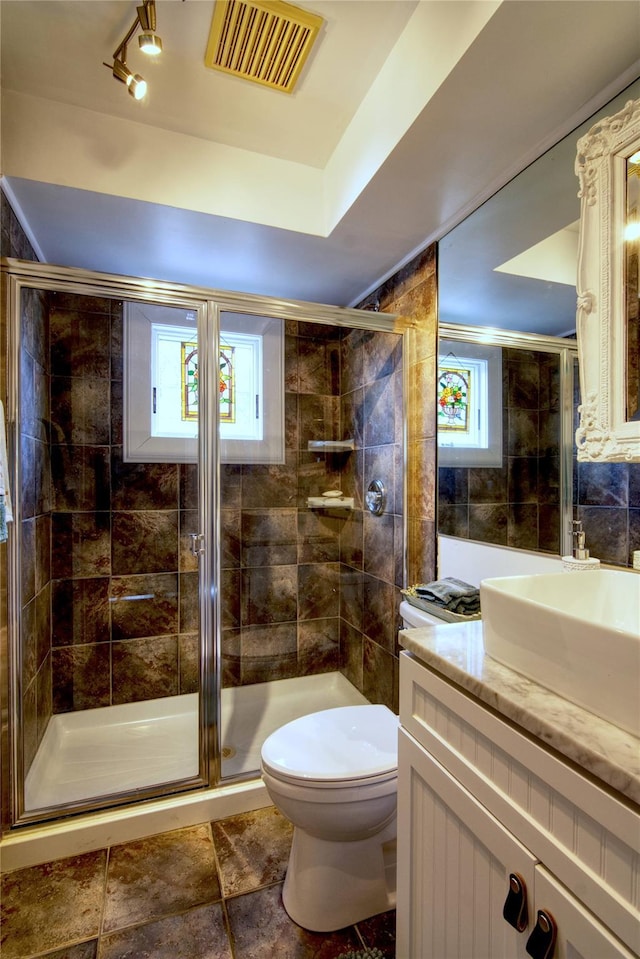 301 Lewis Walk, Cherry Grove, NY 11782 - full bath with a wealth of natural light, visible vents, a stall shower, and toilet